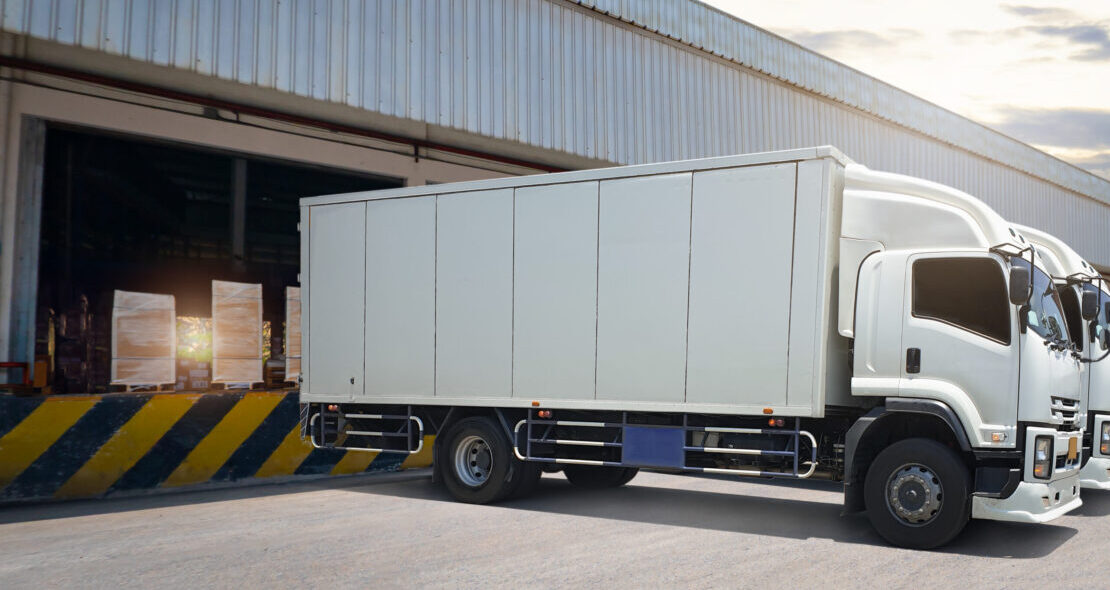 Trucks Parked Loading at Dock Warehouse. Package Boxes Pallets, Cargo Container Shipping, Delivery Trucks,  Distribution Warehouse Supplies Shipment. Freight Truck Logistic, Cargo Transport