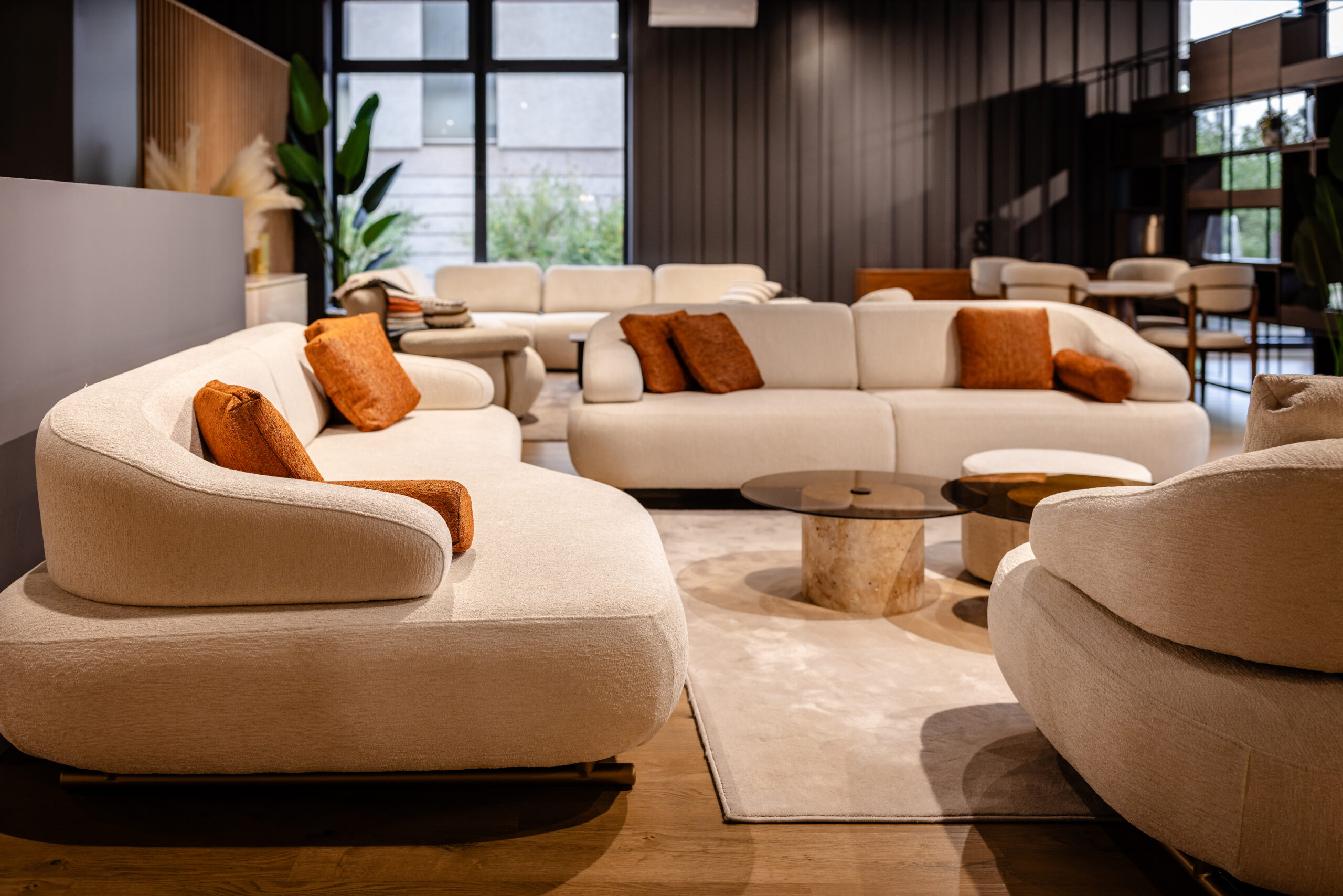 Spacious living area with modern white sofas